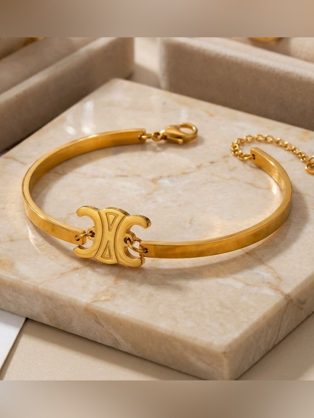 Designer Gold Triomphe Articulated Bangle Bracelet